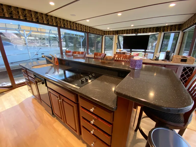 Slide: The Image of Luxurious 2005 Skipperliner Millenium yacht interior with modern kitchen and panoramic windows. - 14