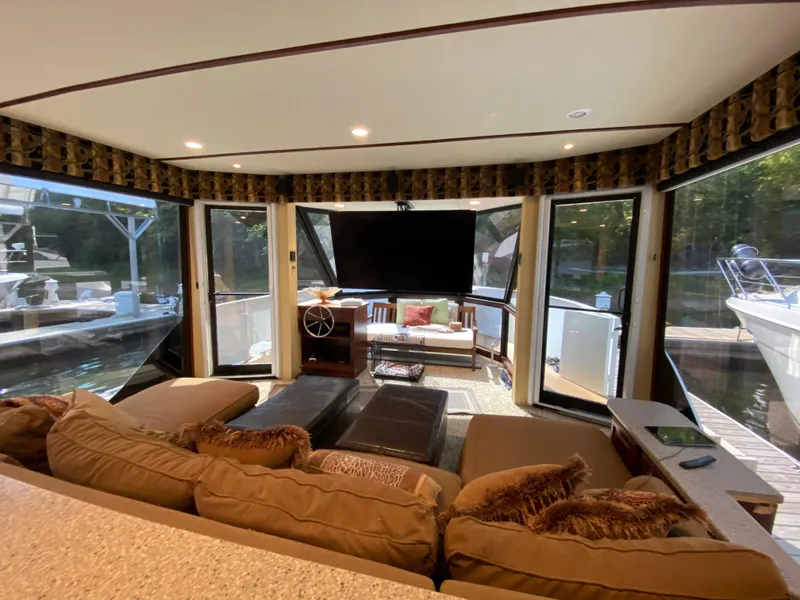 Slide: The Image of Luxurious interior of 2005 Skipperliner Millenium yacht with elegant wood cabinetry and large windows. - 16