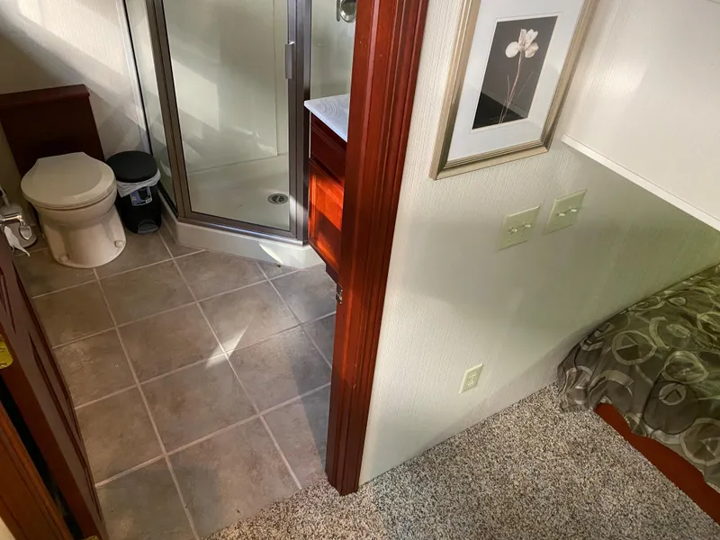 Slide: The Image of Interior of 2005 Skipperliner Millenium with kitchen and stairway leading to lower deck. - 18