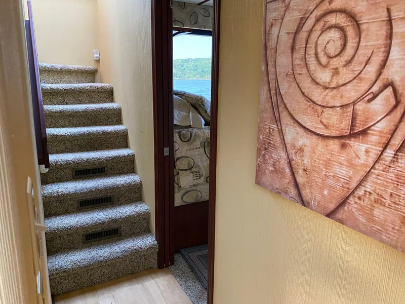 Slide: The Image of 2005 Skipperliner Millenium bathroom with window, wooden cabinets, and modern fixtures. - 25