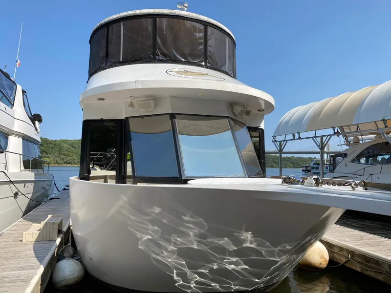 Slide: The Image of 2005 Skipperliner Millenium yacht docked under clear blue sky. - 3