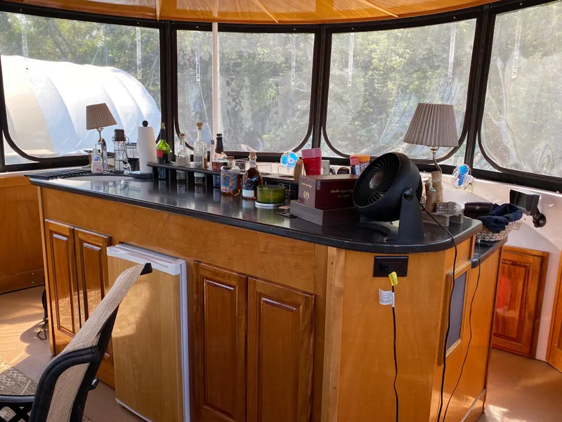 Slide: The Image of Luxurious 2005 Skipperliner Millenium yacht interior with elegant dining area and panoramic windows. - 42