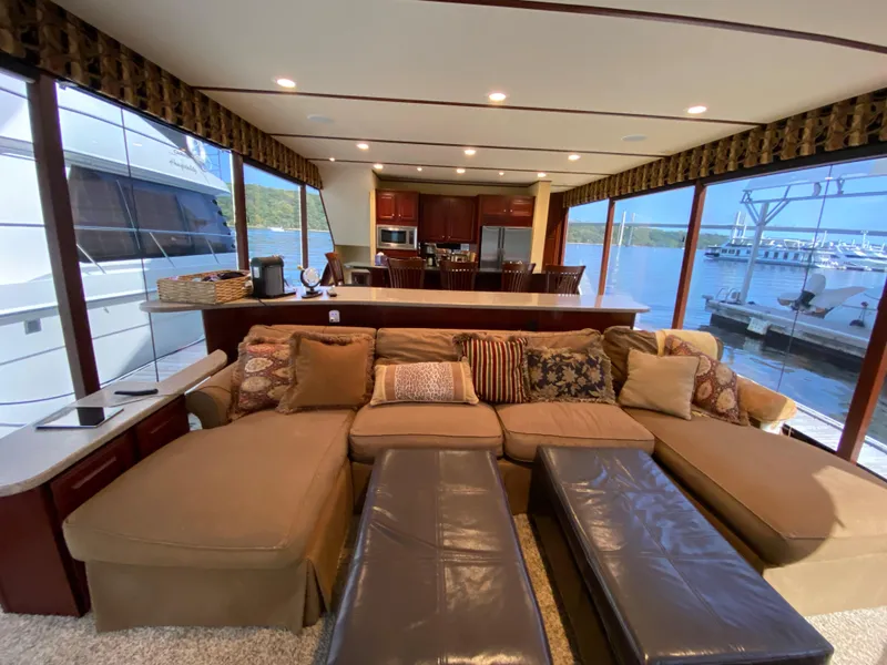 Slide: The Image of Luxurious 2005 Skipperliner Millenium yacht interior with spacious seating and panoramic windows. - 9
