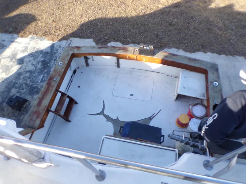 Slide: The Image of 1986 Jersey Dawn 40 boat deck with fishing gear and storage compartments. - 5