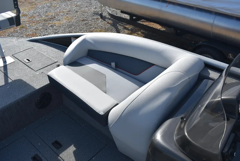 Slide: The Image of 2025 Lowe SD224 Sport Deck boat interior seating, gray upholstery, modern design. - 12