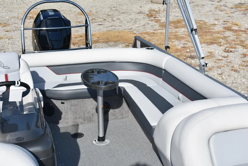 Slide: The Image of 2025 Lowe SD224 Sport Deck boat interior with seating and table. - 14