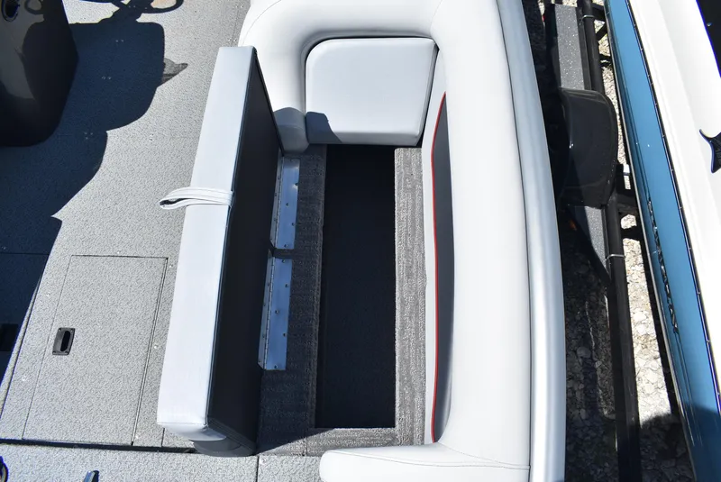 Slide: The Image of 2025 Lowe SD224 Sport Deck boat interior with gray seating and storage compartment. - 18