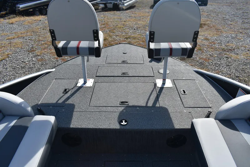 Slide: The Image of 2025 Lowe SD224 Sport Deck boat interior with dual seats and storage compartments. - 19