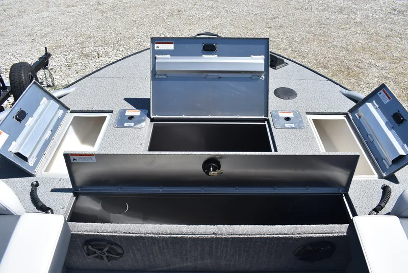 Slide: The Image of 2025 Lowe SD224 Sport Deck boat storage compartments open on deck. - 21