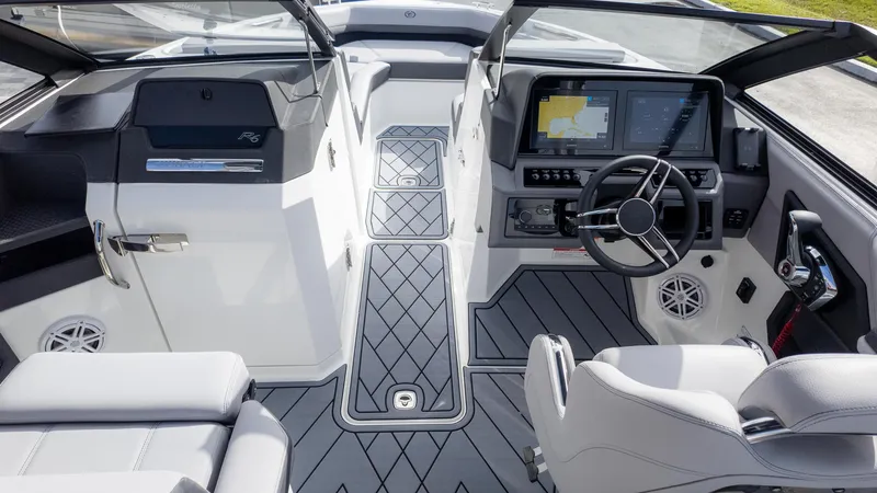 Slide: The Image of Interior of 2025 Cobalt R6 Outboard boat with modern dashboard and seating. - 10