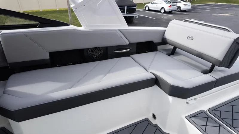 Slide: The Image of 2025 Cobalt R6 Outboard boat interior with sleek gray seating and modern design. - 16
