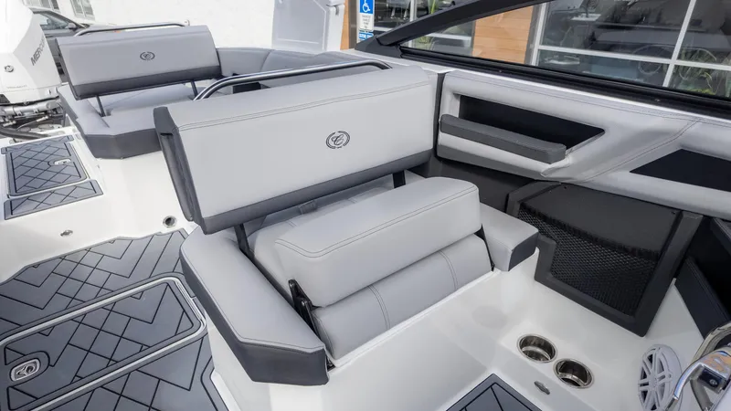 Slide: The Image of 2025 Cobalt R6 Outboard boat interior with sleek gray seating and modern design. - 22