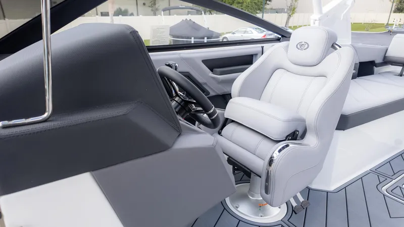 Slide: The Image of 2025 Cobalt R6 Outboard boat interior with sleek captain's chair and modern dashboard. - 31