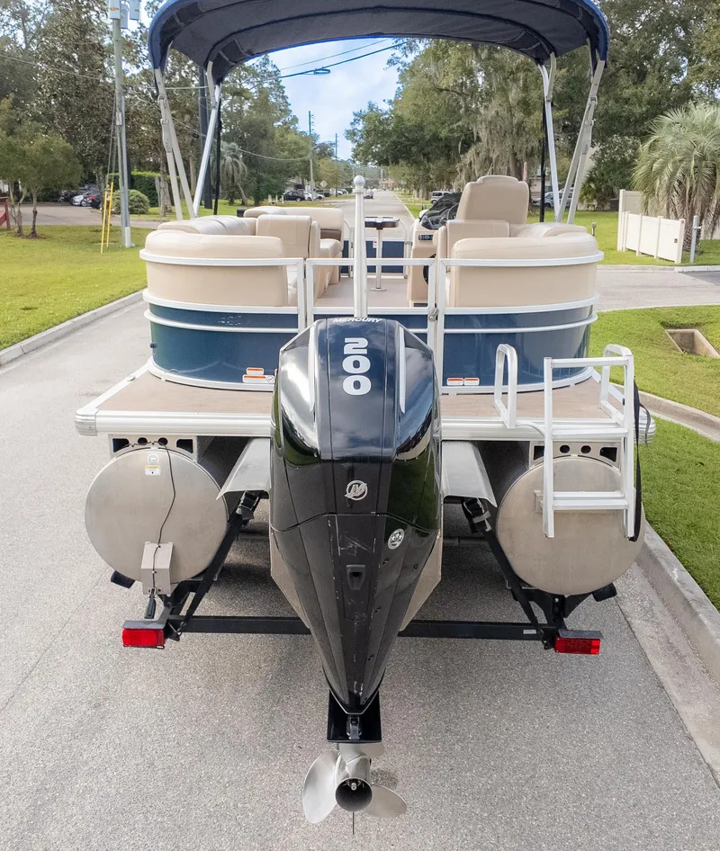 Slide: The Image of 2025 Cobalt R6 Outboard boat with powerful engine, parked on a street. - 7