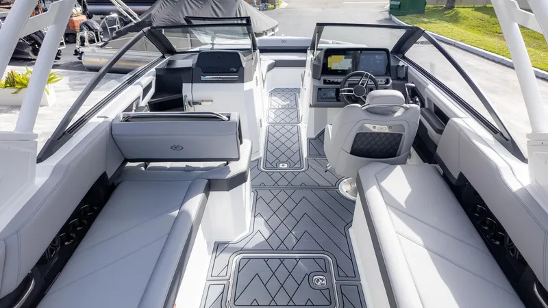Slide: The Image of 2025 Cobalt R6 Outboard boat interior with modern seating and advanced dashboard. - 9