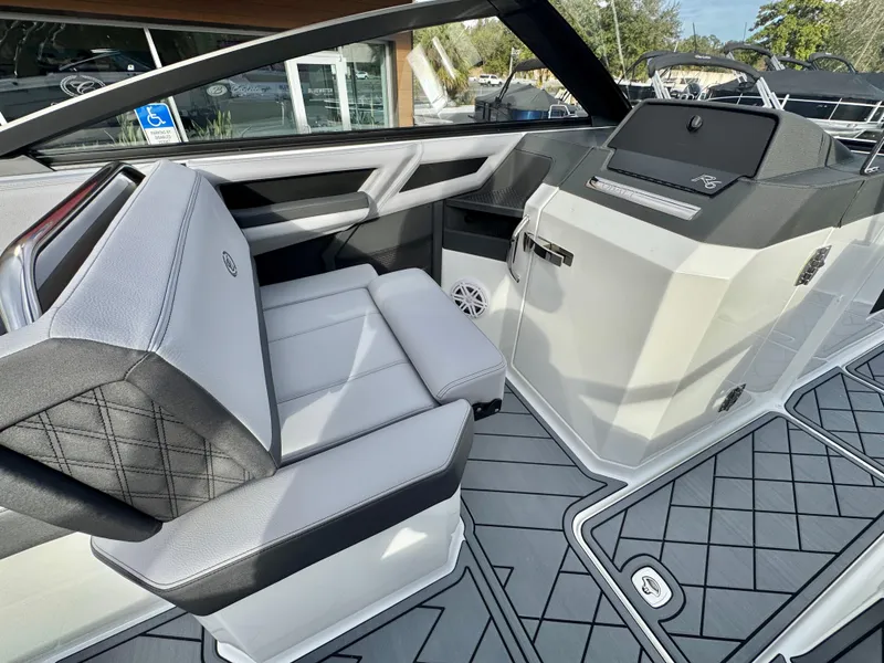 Slide: The Image of 2025 Cobalt R6 Outboard boat interior with modern seating and sleek dashboard design. - 18