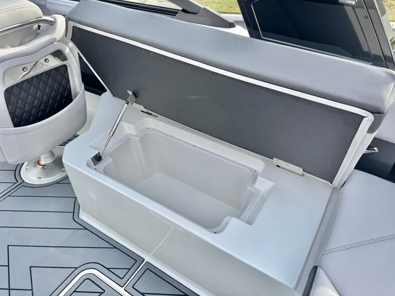 Slide: The Image of 2025 Cobalt R6 Outboard boat interior with open storage compartment. - 26