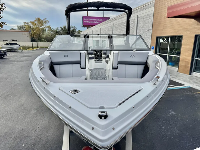 Slide: The Image of 2025 Cobalt R6 Outboard boat, sleek design, parked outdoors. - 3