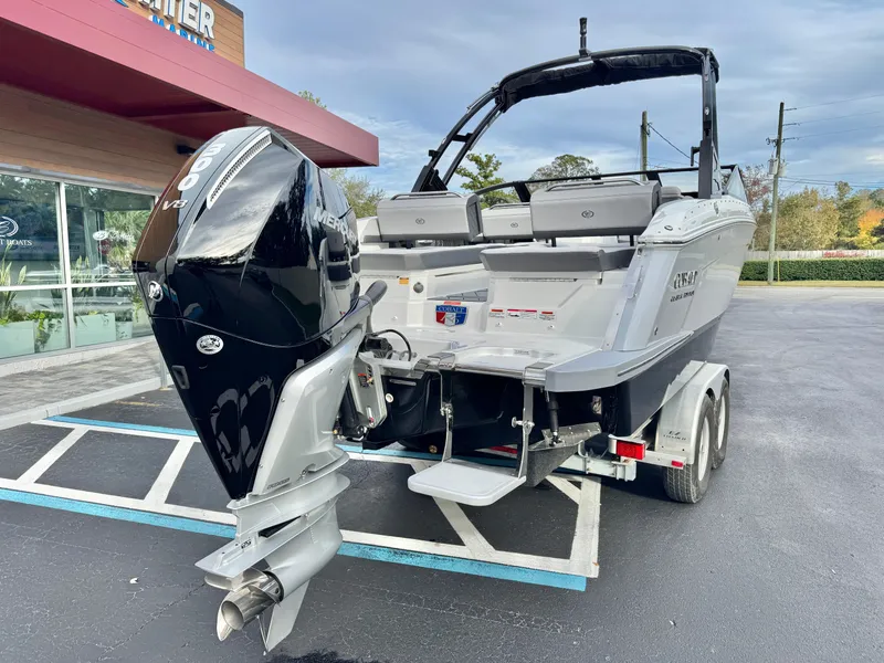 Slide: The Image of 2025 Cobalt R6 Outboard boat on trailer, parked outside dealership. - 6