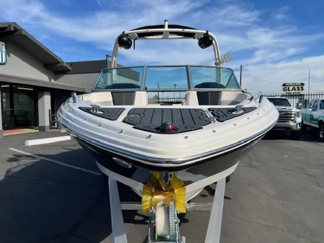 Slide: The Image of 2019 Chaparral 23 H2O Surf boat on trailer, parked outdoors. - 3