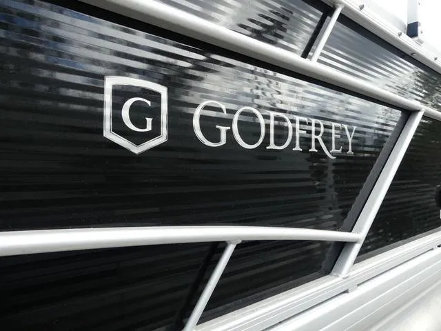 Slide: The Image of 2024 Godfrey Pontoons Sweetwater 2186 C logo on black panel. - 3