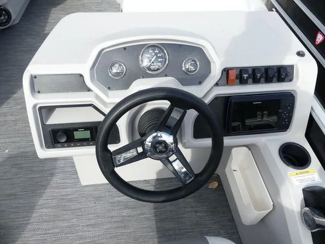 Slide: The Image of 2024 Godfrey Pontoons Sweetwater 2186 C dashboard with steering wheel and controls. - 9