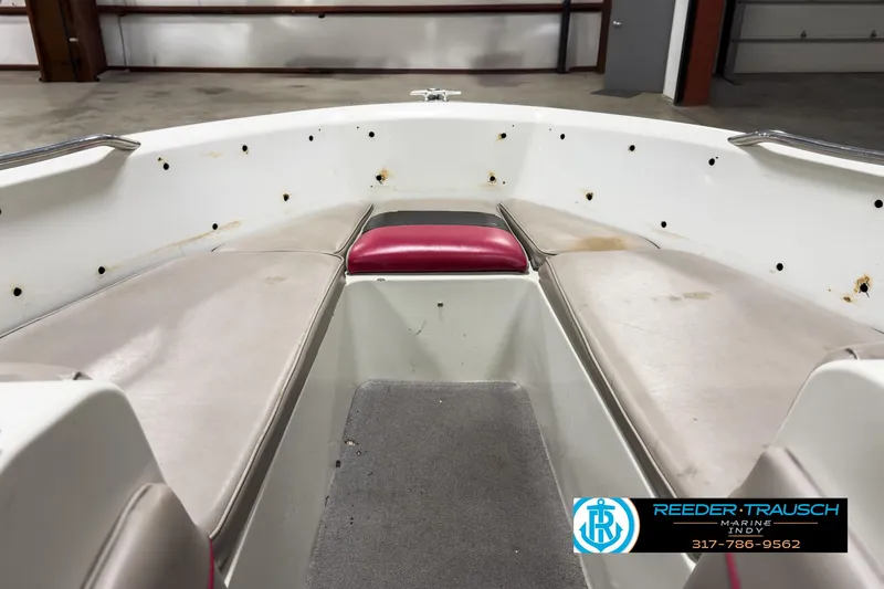 Slide: The Image of Interior of a 1993 Bryant 200 boat with seating and carpeted floor. - 15