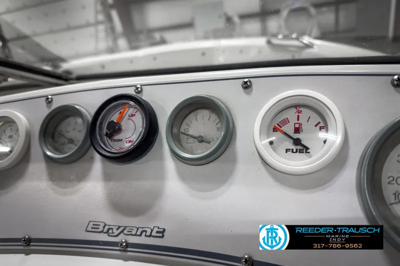 Slide: The Image of Dashboard of a 1993 Bryant 200 boat with fuel and RPM gauges. - 23