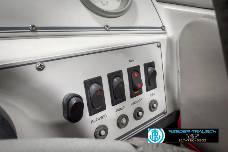 Slide: The Image of Control panel of a 1993 Bryant 200 boat with various switches and buttons. - 25