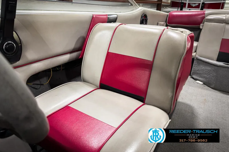 Slide: The Image of 1993 Bryant 200 boat interior with red and beige seats. - 26