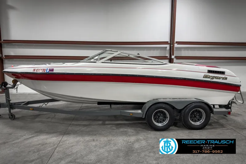 Slide: The Image of 1993 Bryant 200 boat on trailer in indoor storage facility. - 3