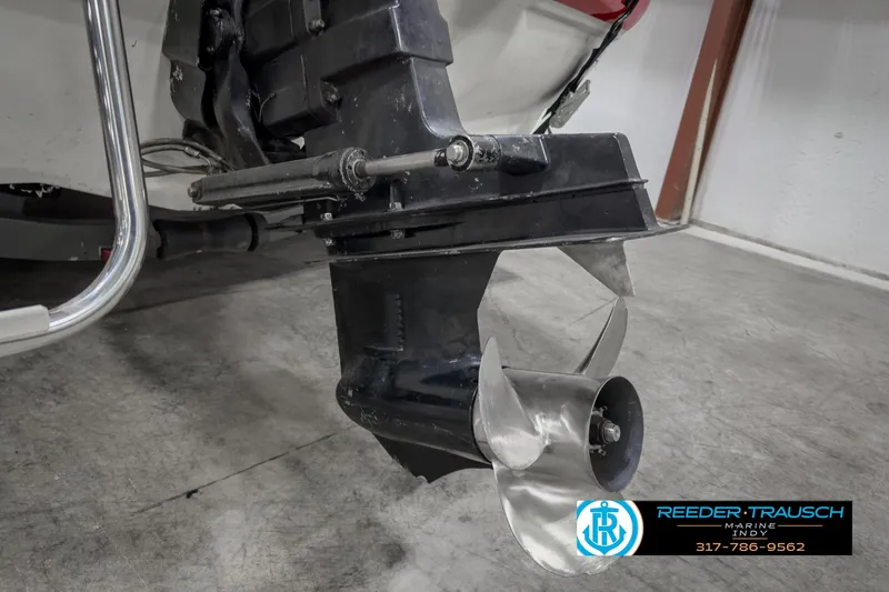 Slide: The Image of 1993 Bryant 200 boat propeller and outdrive in a garage setting. - 34