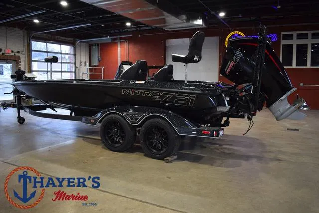 Slide: The Image of 2025 Nitro Z21 XL Pro boat displayed indoors at Thayer's Marine. - 10