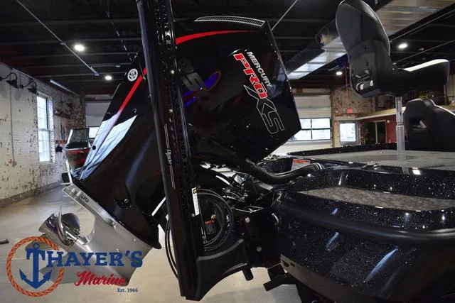 Slide: The Image of 2025 Nitro Z21 XL Pro boat with powerful engine in showroom. - 11