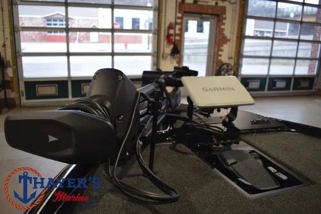 Slide: The Image of 2025 Nitro Z21 XL Pro boat with Garmin equipment in a garage setting. - 12