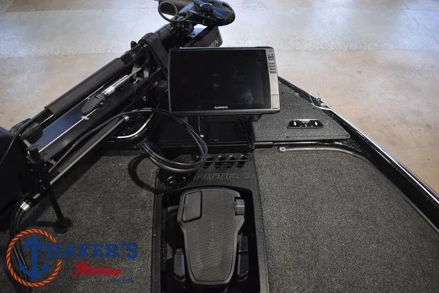 Slide: The Image of 2025 Nitro Z21 XL Pro boat dashboard with Garmin display and foot pedal. - 13