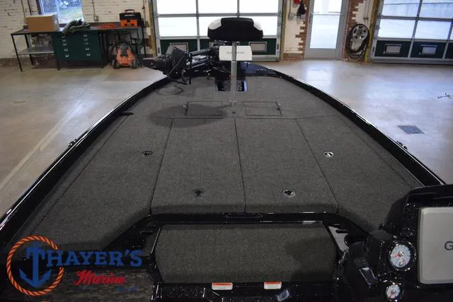 Slide: The Image of 2025 Nitro Z21 XL Pro boat interior with spacious deck in a showroom. - 17