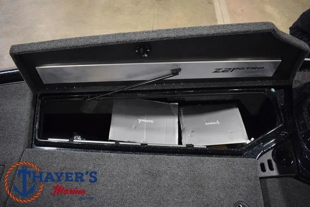 Slide: The Image of 2025 Nitro Z21 XL Pro boat storage compartment with Garmin electronics. - 19