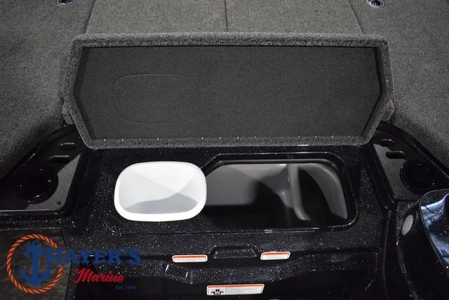 Slide: The Image of 2025 Nitro Z21 XL Pro boat storage compartment with open lid, featuring spacious interior. - 22