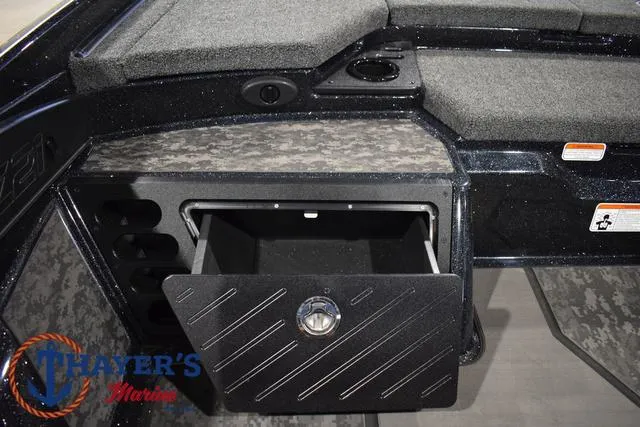 Slide: The Image of 2025 Nitro Z21 XL Pro boat storage compartment with open hatch. - 25