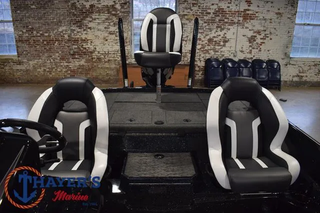 Slide: The Image of 2025 Nitro Z21 XL Pro boat interior with three black and white seats. - 26