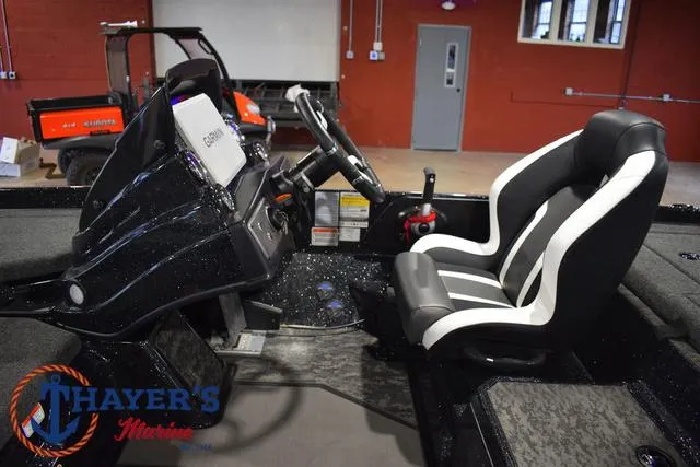 Slide: The Image of 2025 Nitro Z21 XL Pro boat interior with steering console and seating. - 29