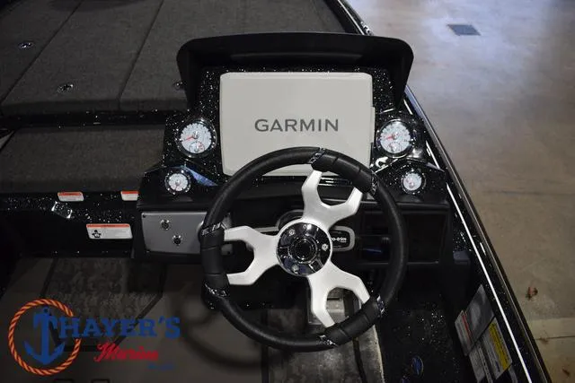 Slide: The Image of Nitro Z21 XL Pro 2025 boat dashboard with Garmin display and steering wheel. - 31