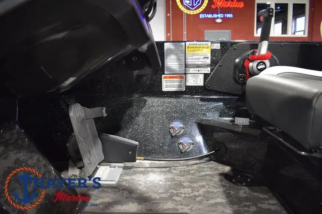 Slide: The Image of Interior of 2025 Nitro Z21 XL Pro boat showing controls and foot pedal. - 32
