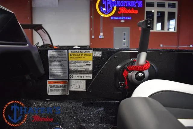 Slide: The Image of 2025 Nitro Z21 XL Pro boat interior with control panel and safety labels. - 33