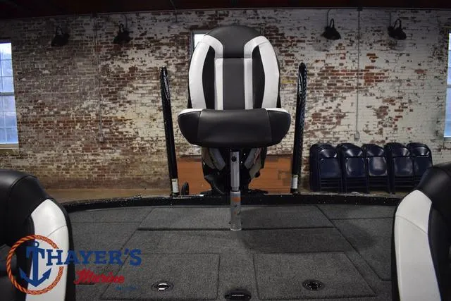 Slide: The Image of 2025 Nitro Z21 XL Pro boat interior with seating and carpeted deck. - 37