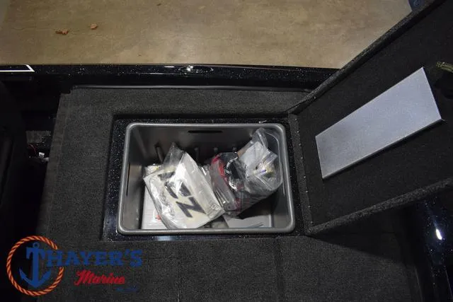 Slide: The Image of 2025 Nitro Z21 XL Pro storage compartment with gear inside, displayed at Thayer's Marine. - 39