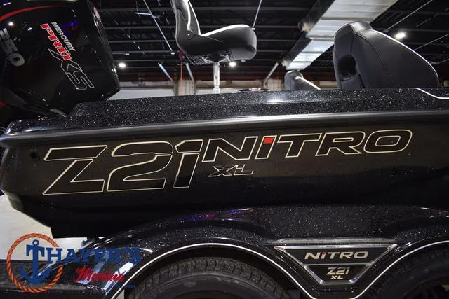 Slide: The Image of 2025 Nitro Z21 XL Pro boat with sleek design and branding in showroom. - 4
