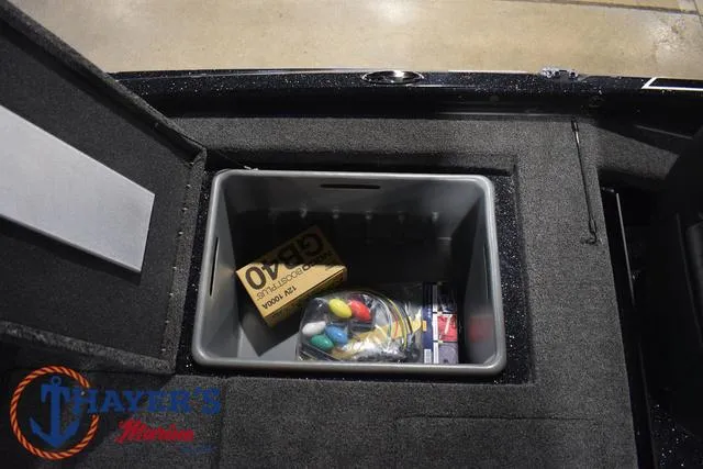 Slide: The Image of Storage compartment of 2025 Nitro Z21 XL Pro boat with accessories. - 40