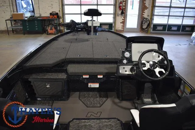 Slide: The Image of 2025 Nitro Z21 XL Pro boat interior with Garmin dashboard in a showroom. - 42